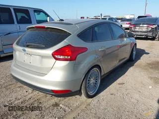 2015 Ford Focus SE with VIN 1FADP3K23FL261021, listed as a IAAI auction lot 42014802 with 157,283 mi miles. Bid and sale history available at carsss.com. Image 4.