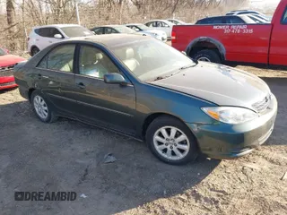2002 Toyota Camry XLE z VIN 4T1BF30K62U528305, wystawiony jako IAAI lot #41771959 z przebiegiem 132 000 mil mil oraz . Historia ofert i sprzedaży dostępna na DreamBid. Obrazek 1.