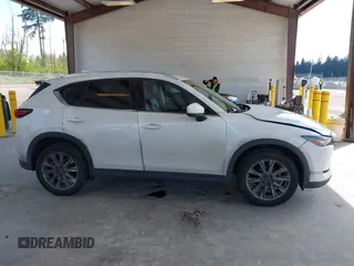 2020 Mazda CX-5 Grand Touring with VIN JM3KFBDM2L0863944, listed as a IAAI auction lot 42150805 with 63,932 mi miles and . Bid and sale history available at DreamBid. Image 13.