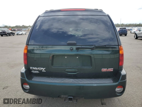 2003 GMC Envoy SLT z VIN 1GKET16P936191818, wystawiony jako Copart lot #53270645 z przebiegiem 130 357 mil mil oraz Szkody całkowita. Historia ofert i sprzedaży dostępna na DreamBid. Obrazek 6.