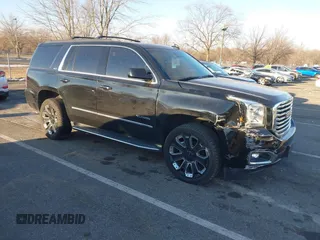 2019 GMC Yukon SLT with VIN 1GKS2BKCXKR307135, listed as a IAAI auction lot 41323052 with 84,292 mi miles. Bid and sale history available at carsss.com. Image 1.