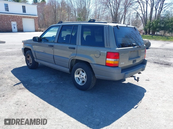 1997 Jeep Grand Cherokee Laredo with VIN 1J4GZ58S7VC713517, listed as a IAAI auction lot 42062214 with 205,533 mi miles. Bid and sale history available at carsss.com. Image 3.