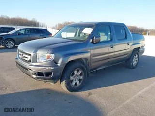 2010 Honda Ridgeline RTS with VIN 5FPYK1F49AB013790, listed as a IAAI auction lot 41769454 with 139,682 mi miles. Bid and sale history available at carsss.com. Image 2.