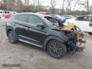 2021 Hyundai Tucson Limited with VIN KM8J33ALXMU284737, listed as a IAAI auction lot 41305762 with 115,000 mi miles. Bid and sale history available at carsss.com. Image 1.
