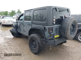 2014 Jeep Wrangler Unlimited Sport with VIN 1C4BJWDG1EL135073, listed as a IAAI auction lot 42435361 with 129,144 mi miles and . Bid and sale history available at DreamBid. Image 3.