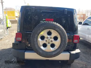 2015 Jeep Wrangler Unlimited Sahara with VIN 1C4BJWEGXFL506361, listed as a IAAI auction lot 41865418 with 80,841 mi miles. Bid and sale history available at carsss.com. Image 16.