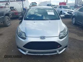 2014 Ford Focus ST z VIN 1FADP3L96EL413447, wystawiony jako IAAI lot #41887304 z przebiegiem 99 448 mil mil oraz . Historia ofert i sprzedaży dostępna na DreamBid. Obrazek 11.