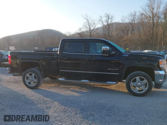 2015 GMC Sierra 2500HD available WiFi SLT with VIN 1GT12ZEG7FF606328, listed as a IAAI auction lot 41793799 with 94,107 mi miles. Bid and sale history available at carsss.com. Image 13.