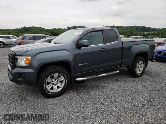 2015 GMC Canyon 2WD SLE with VIN 1GTH5BEA7F1158758, listed as a Copart auction lot 63617524 with 102,744 mi miles and Salvage Title. Bid and sale history available at carsss.com. Image 1.