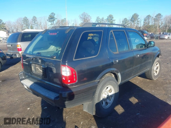 2003 Isuzu Rodeo with VIN 4S2CK58W034303195, listed as a IAAI auction lot 41219379 with 215,821 mi miles and . Bid and sale history available at DreamBid. Image 4.