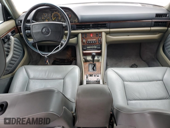 1989 Mercedes-Benz 560 with VIN WDBCA39E0KA469417, listed as a Copart auction lot 43929215 with 52,559 mi miles and Salvage Title. Bid and sale history available at DreamBid. Image 8.