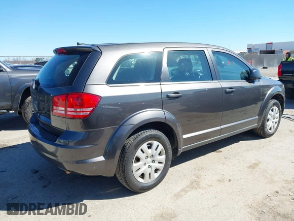 2015 Dodge Journey SE z VIN 3C4PDCAB5FT739266, wystawiony jako IAAI lot #41725086 z przebiegiem 134 109 mil mil oraz . Historia ofert i sprzedaży dostępna na DreamBid. Obrazek 4.