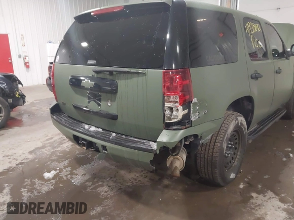 2014 Chevrolet Tahoe Commercial with VIN 1GNSK2E05ER196941, listed as a IAAI auction lot 41938892 with 176,170 mi miles and . Bid and sale history available at DreamBid. Image 6.