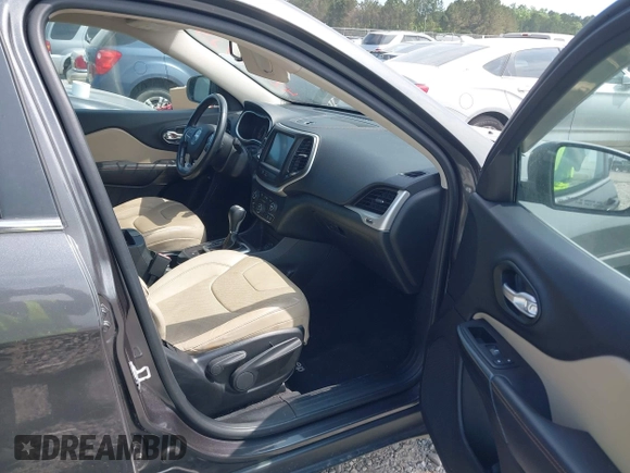 2015 Jeep Cherokee Limited with VIN 1C4PJLDS9FW516548, listed as a IAAI auction lot 42108725 with 122,190 mi miles and . Bid and sale history available at DreamBid. Image 5.