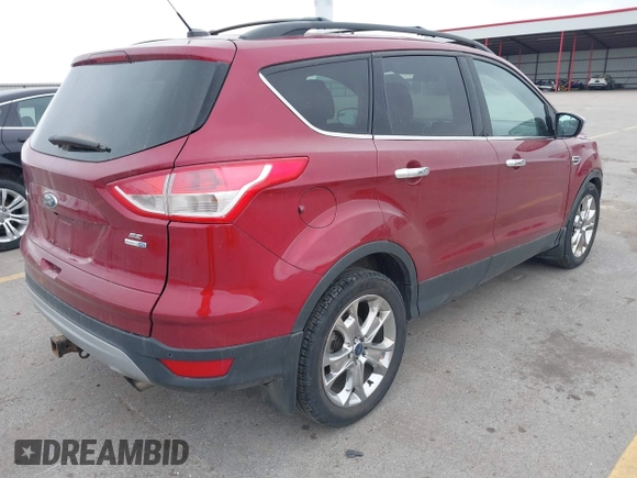 2014 Ford Escape SE with VIN 1FMCU9G90EUD89356, listed as a IAAI auction lot 41841229 with 148,997 mi miles and . Bid and sale history available at carsss.com. Image 4.