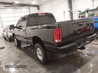 2005 Dodge Ram 3500 SLT with VIN 3D7LS38C85G810265, listed as a IAAI auction lot 41856058 with 164,027 mi miles. Bid and sale history available at carsss.com. Image 3.