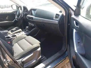 2016 Mazda CX-5 Touring with VIN JM3KE4CYXG0620990, listed as a IAAI auction lot 41978738 with 91,237 mi miles and . Bid and sale history available at carsss.com. Image 5.