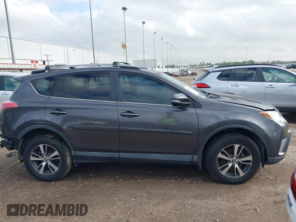 2018 Toyota RAV4 XLE with VIN 2T3WFREV4JW417555, listed as a IAAI auction lot 41092589 with 93,788 mi miles and . Bid and sale history available at DreamBid. Image 14.