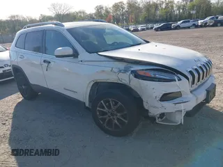 2015 Jeep Cherokee Latitude with VIN 1C4PJLCS6FW689607, listed as a IAAI auction lot 42103286 with 142,479 mi miles. Bid and sale history available at carsss.com. Image 1.