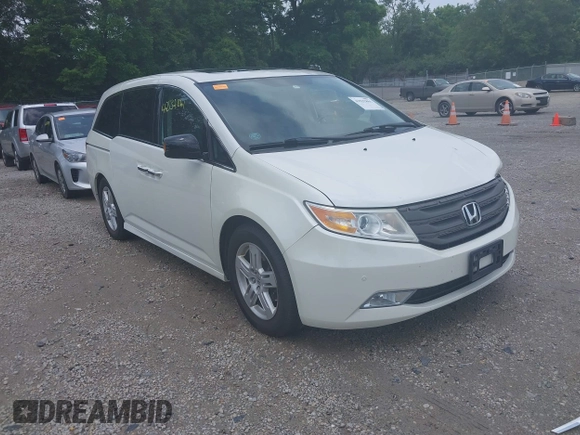 2013 Honda Odyssey Touring with VIN 5FNRL5H9XDB049390, listed as a IAAI auction lot 42532861 with 129,376 mi miles and . Bid and sale history available at DreamBid. Image 1.