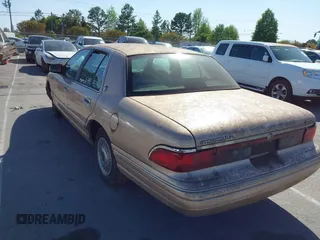 1996 Mercury Grand Marquis GS with VIN 2MELM74W3TX670994, listed as a IAAI auction lot 42052604 with 46,728 mi miles and . Bid and sale history available at DreamBid. Image 3.