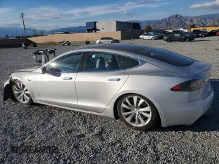 2016 Tesla Model S 90D with VIN 5YJSA1E26GF147974, listed as a Copart auction lot 82815404 with 126,609 mi miles and Salvage Title. Bid and sale history available at DreamBid. Image 2.