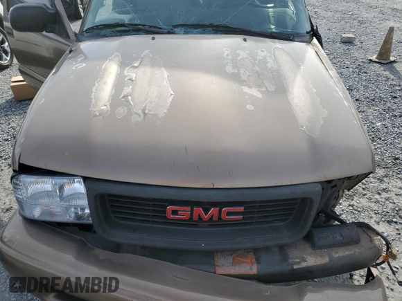 2003 GMC Sonoma SLS z VIN 1GTCS19X538182443, wystawiony jako Copart lot #84875374 z przebiegiem Nie podano mil oraz Szkody całkowita. Historia ofert i sprzedaży dostępna na DreamBid. Obrazek 11.