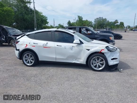 2023 Tesla Model Y Long Range with VIN 7SAYGDEE3PA206757, listed as a IAAI auction lot 39425483 with 5,711 mi miles and . Bid and sale history available at DreamBid. Image 13.