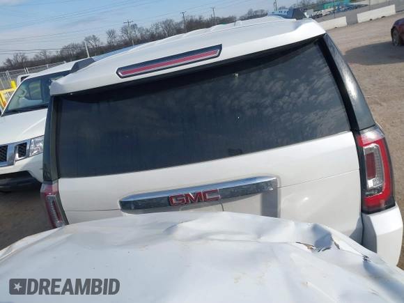 2020 GMC Yukon XL Denali with VIN 1GKS1HKJ6LR282854, listed as a IAAI auction lot 41717072 with 56,715 mi miles and . Bid and sale history available at DreamBid. Image 16.