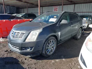2014 Cadillac SRX Premium Collection z VIN 3GYFNDE34ES581728, wystawiony jako IAAI lot #41578226 z przebiegiem 121 118 mil mil oraz . Historia ofert i sprzedaży dostępna na DreamBid. Obrazek 18.