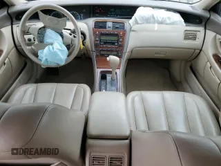 2000 Toyota Avalon XL with VIN 4T1BF28B4YU105732, listed as a Copart auction lot 54752665 with 143,855 mi miles and Salvage Title. Bid and sale history available at DreamBid. Image 8.