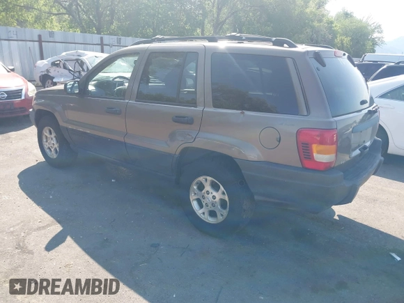 2001 Jeep Grand Cherokee Laredo with VIN 1J4GW48S81C694537, listed as a IAAI auction lot 42447828 with 162,981 mi miles and . Bid and sale history available at DreamBid. Image 3.