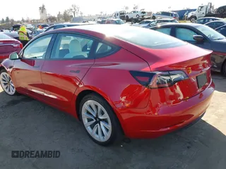 2021 Tesla Model 3 Long Range with VIN 5YJ3E1EBXMF990242, listed as a IAAI auction lot 41674222 with 24,554 mi miles and . Bid and sale history available at DreamBid. Image 3.