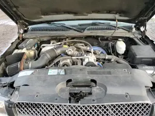 2003 Chevrolet Silverado 2500HD LS z VIN 1GCHK23143F107714, wystawiony jako Copart lot #82587134 z przebiegiem 178 354 mil mil oraz Szkoda całkowita • Salvage title. Historia ofert i sprzedaży dostępna na DreamBid. Obrazek 13.