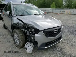 2014 Mazda CX-5 Touring z VIN JM3KE4CY0E0407169, wystawiony jako Copart lot #57877215 z przebiegiem 168 277 mil mil oraz Szkoda całkowita • Salvage title. Historia ofert i sprzedaży dostępna na DreamBid. Obrazek 14.