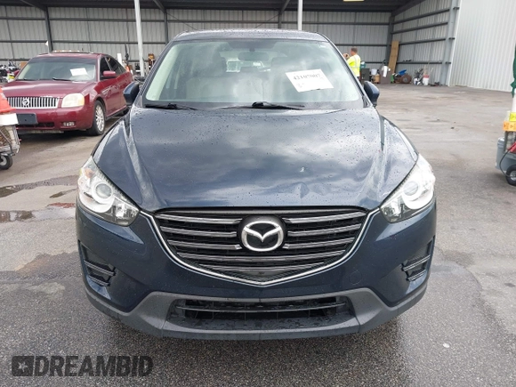 2016 Mazda CX-5 Sport with VIN JM3KE2BY0G0850298, listed as a IAAI auction lot 42107007 with 97,478 mi miles. Bid and sale history available at carsss.com. Image 12.