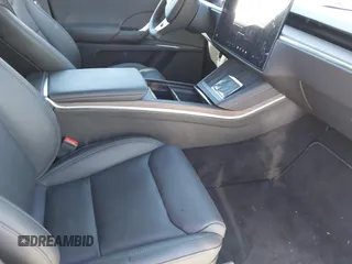 2023 Tesla Model X with VIN 7SAXCDE54PF430808, listed as a IAAI auction lot 41667924 with 21,100 mi miles and . Bid and sale history available at DreamBid. Image 5.