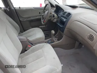 2000 Mazda Protege DX with VIN JM1BJ2223Y0212144, listed as a IAAI auction lot 41570436 with 221,430 mi miles and . Bid and sale history available at DreamBid. Image 5.