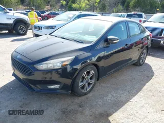 2016 Ford Focus SE with VIN 1FADP3FE7GL202284, listed as a IAAI auction lot 42014457 with 130,000 mi miles. Bid and sale history available at carsss.com. Image 2.