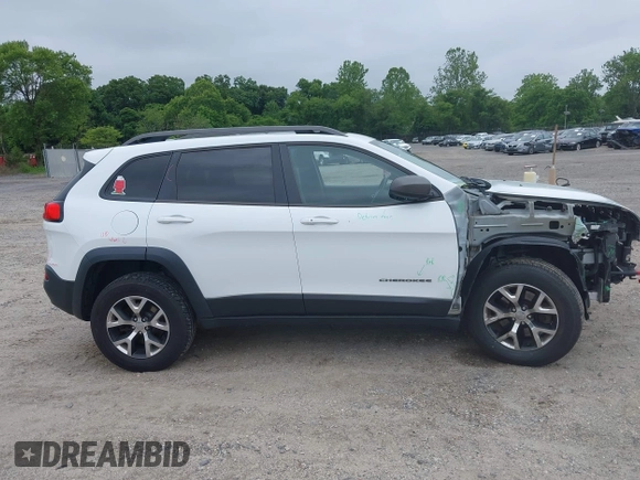 2014 Jeep Cherokee Trailhawk z VIN 1C4PJMBS4EW210719, wystawiony jako IAAI lot #42461733 z przebiegiem 134 096 mil mil oraz . Historia ofert i sprzedaży dostępna na DreamBid. Obrazek 13.