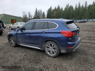 2018 BMW X1 xDrive28i with VIN WBXHT3C37J5F89432, listed as a Copart auction lot 49677075 with 141,684 mi miles and Salvage Title. Bid and sale history available at carsss.com. Image 2.