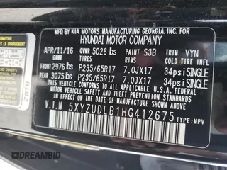 2017 Hyundai Santa Fe 2.4L z VIN 5XYZUDLB1HG412675, wystawiony jako Copart lot #57169045 z przebiegiem 38 947 mil mil oraz Szkoda całkowita • Salvage title. Historia ofert i sprzedaży dostępna na DreamBid. Obrazek 13.