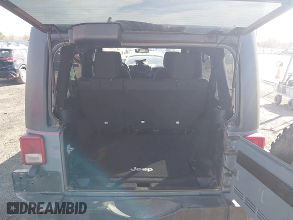 2015 Jeep Wrangler Unlimited Willys Wheeler with VIN 1C4BJWDG4FL589822, listed as a IAAI auction lot 41732614 with 149,112 mi miles and . Bid and sale history available at DreamBid. Image 8.