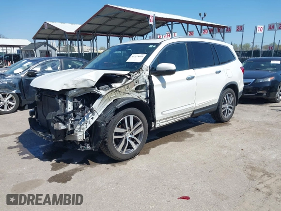 2016 Honda Pilot Touring with VIN 5FNYF6H9XGB005516, listed as a IAAI auction lot 41975049 with 85,217 mi miles. Bid and sale history available at carsss.com. Image 2.