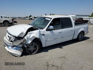 2001 Ford F-150 XLT with VIN 1FTRW07651KC49772, listed as a Copart auction lot 59904815 with 145,639 mi miles and Salvage title. Bid and sale history available at DreamBid. Image 1.