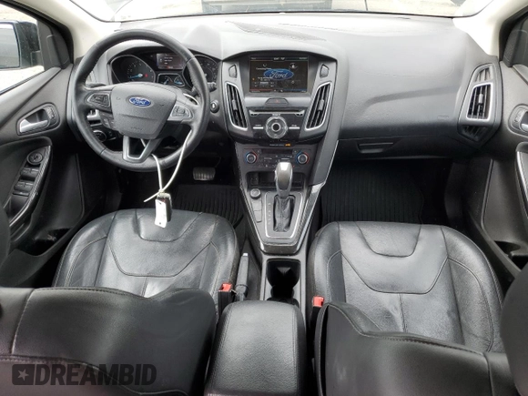 2015 Ford Focus Titanium z VIN 1FADP3N25FL324390, wystawiony jako Copart lot #59801805 z przebiegiem 97 615 mil mil oraz Szkoda całkowita • Salvage title. Historia ofert i sprzedaży dostępna na DreamBid. Obrazek 8.