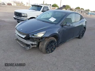 2023 Tesla Model Y Long Range with VIN 7SAYGDEE1PA053683, listed as a IAAI auction lot 42124517 with 32,295 mi miles. Bid and sale history available at carsss.com. Image 18.