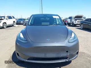 2022 Tesla Model Y Long Range with VIN 7SAYGDEE7NF426404, listed as a IAAI auction lot 42040490 with 39,635 mi miles and . Bid and sale history available at carsss.com. Image 12.