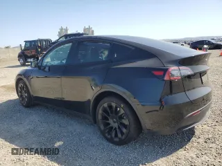 2023 Tesla Model Y Long Range with VIN 7SAYGAEE0PF642810, listed as a Copart auction lot 52181655 with 74,922 mi miles and Salvage Title. Bid and sale history available at DreamBid. Image 2.