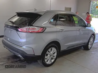 2020 Ford Edge Titanium z VIN 2FMPK4K91LBA91290, wystawiony jako IAAI lot #42494043 z przebiegiem 71 254 mil mil oraz . Historia ofert i sprzedaży dostępna na DreamBid. Obrazek 2.